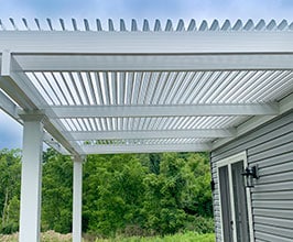 Can a pergola withstand strong winds or heavy snow?